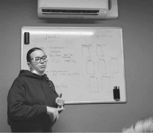 girl presenting in front of the board